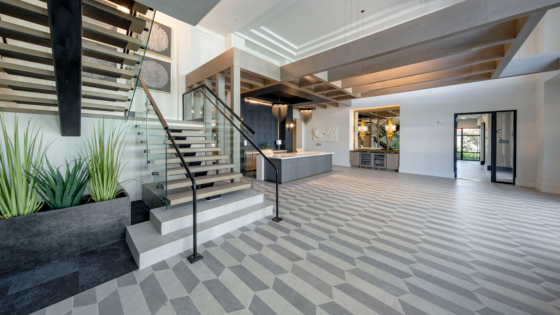 Modern entryway with stylish staircase.