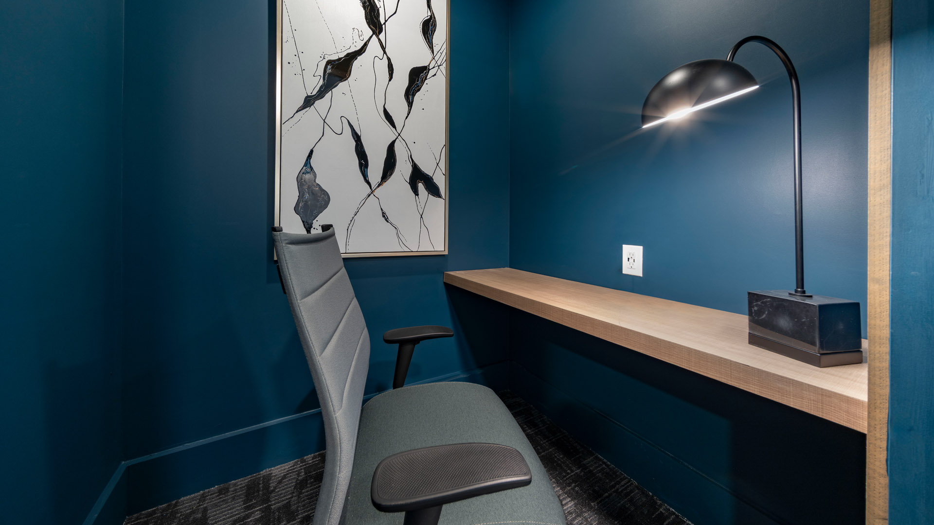 Modern workspace with dark blue walls
