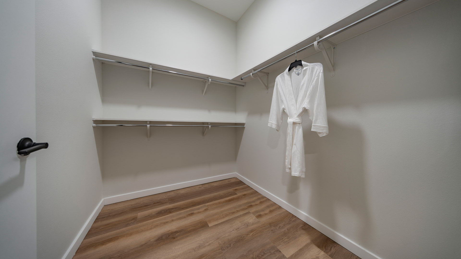 Empty closet with a white robe