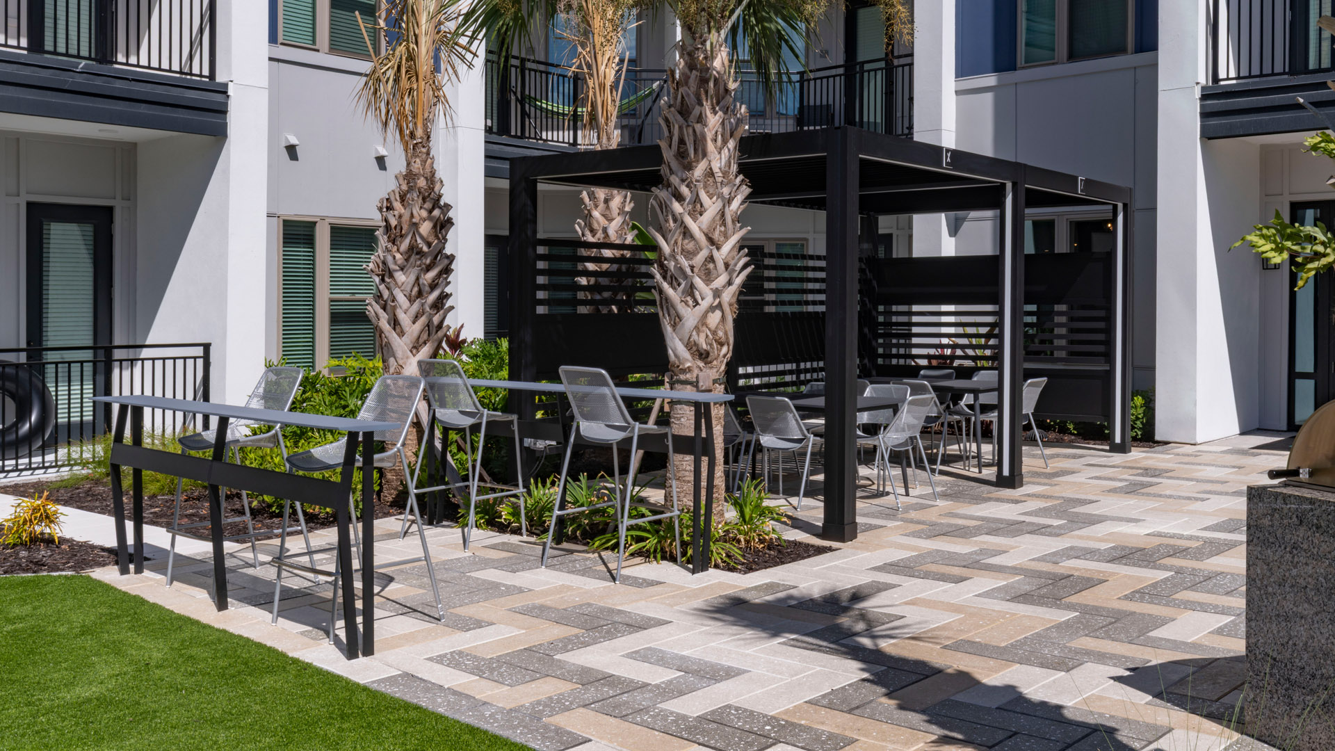Modern outdoor seating area with palms