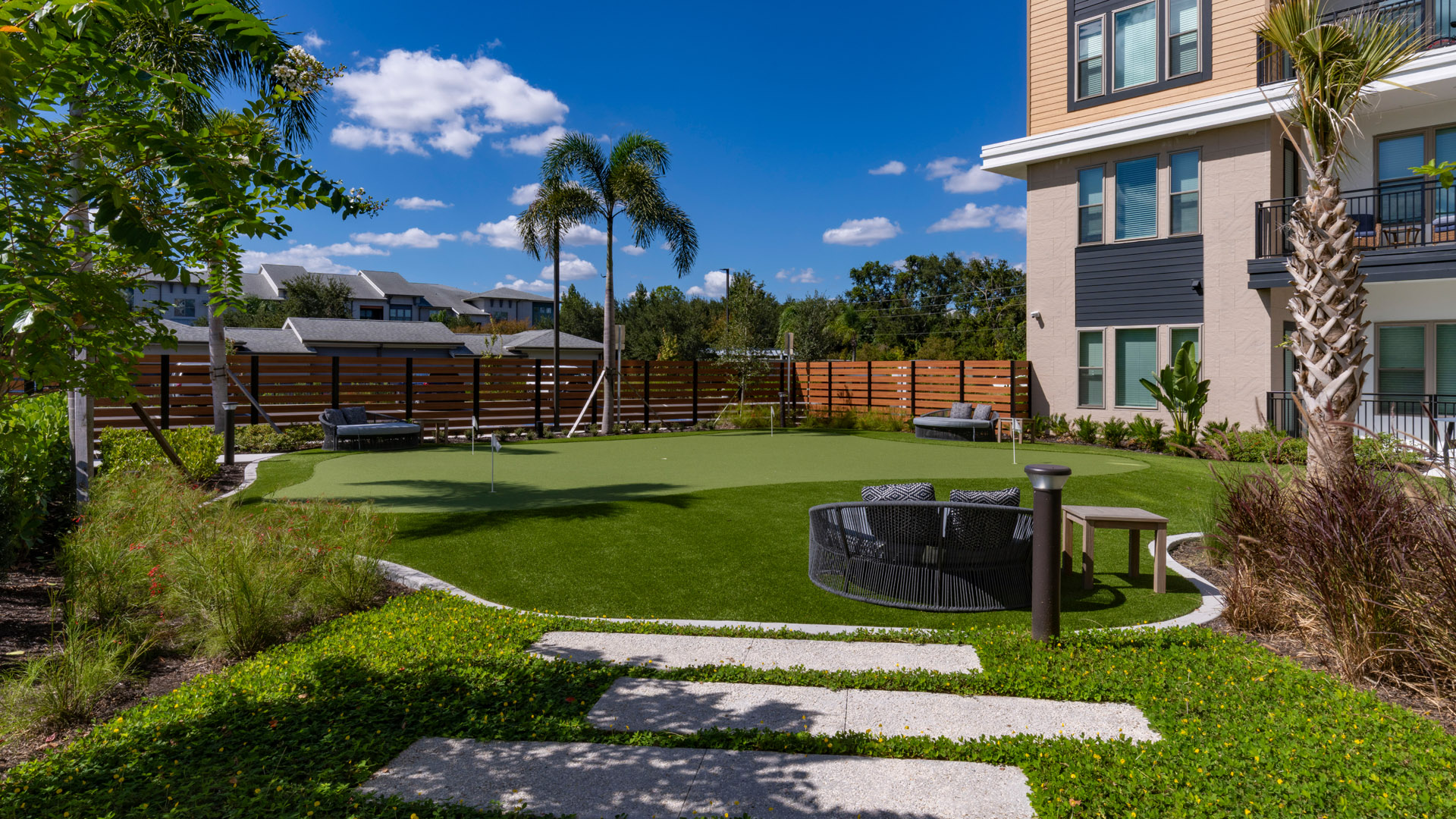 Lush green lawn with seating area