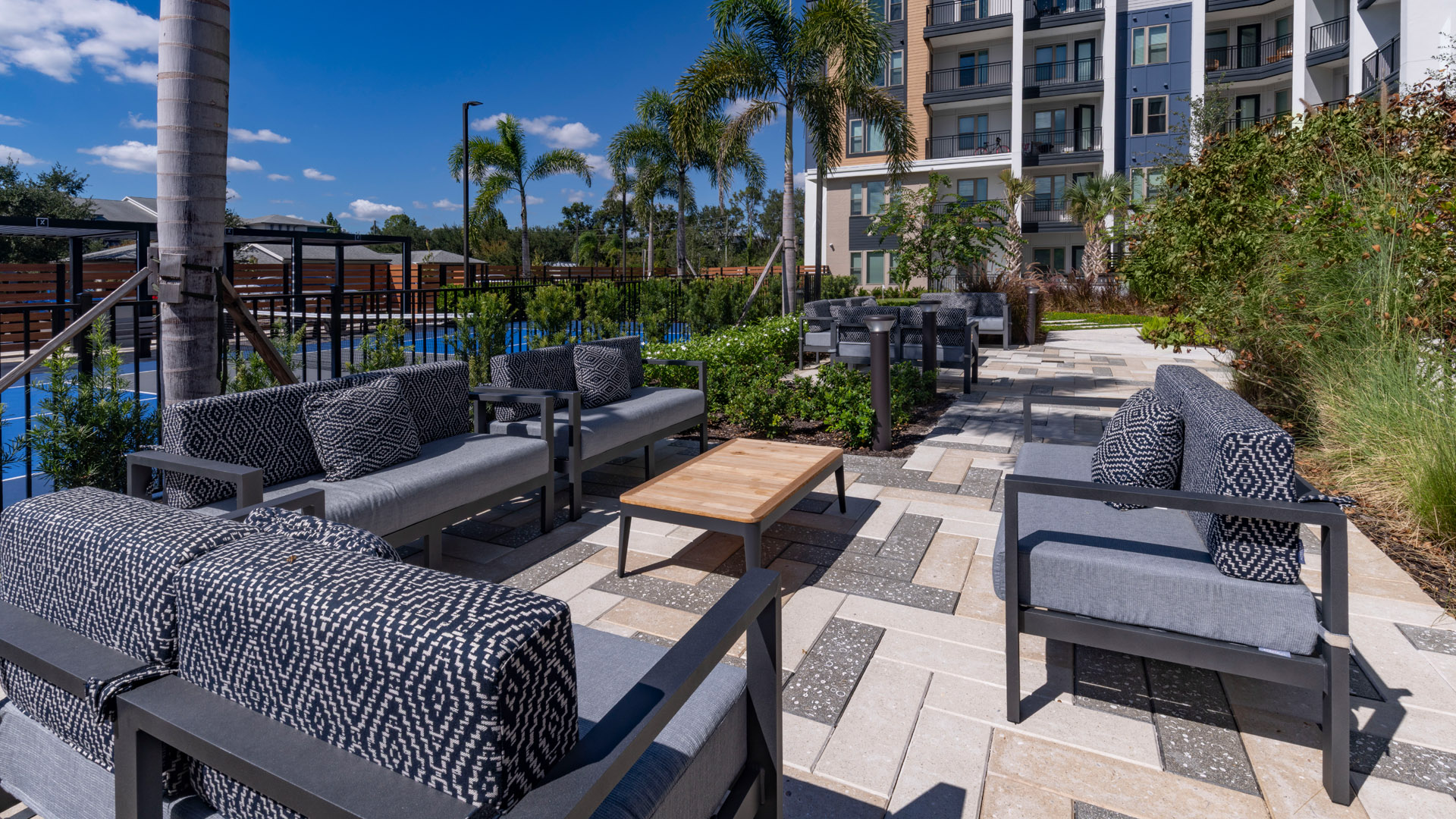 Modern outdoor lounge area with greenery