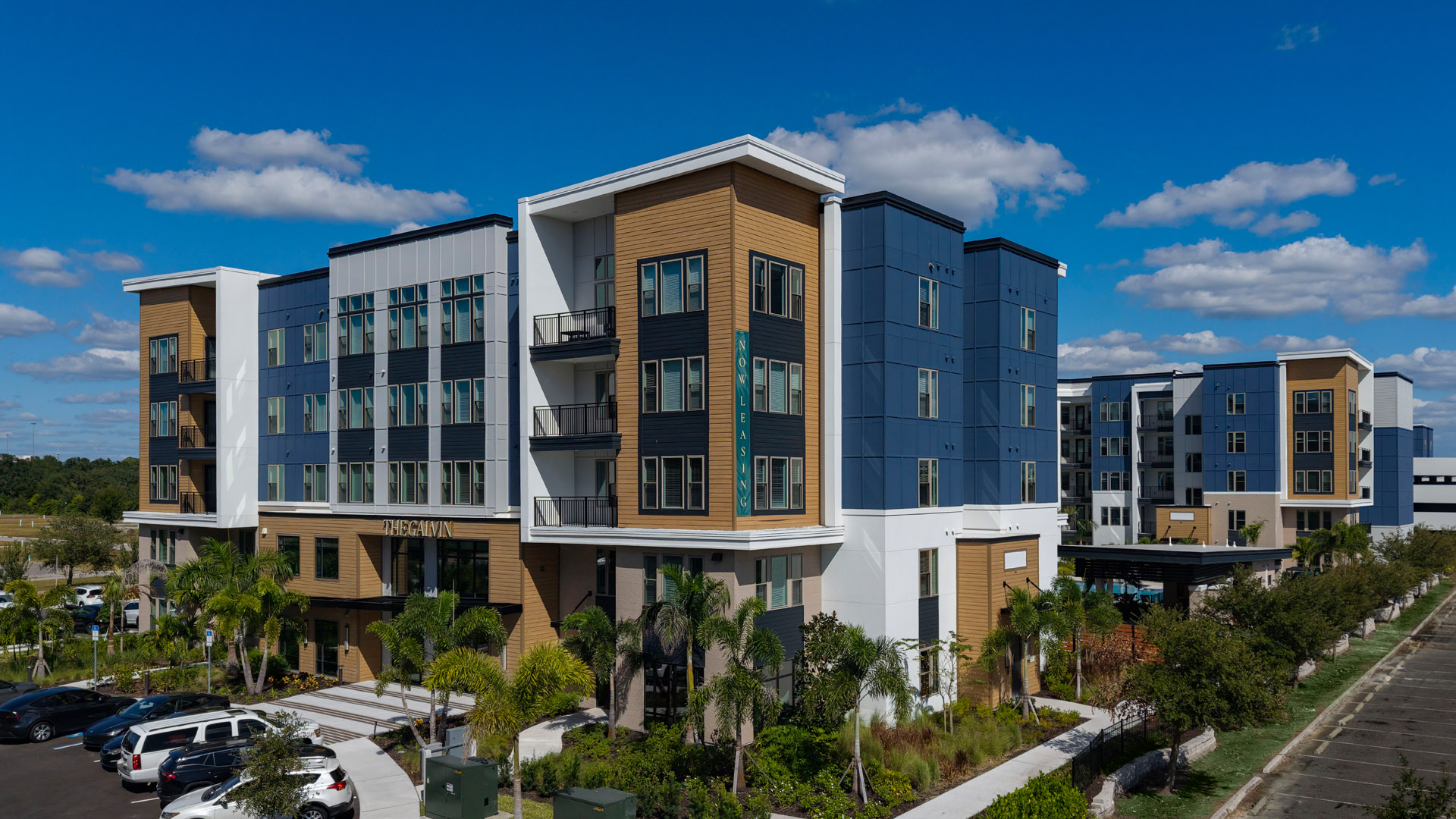 Modern apartment complex with landscaping.